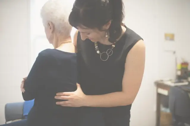 Dr Barbara Bugeja performing osteopathic assessment on patient for pain