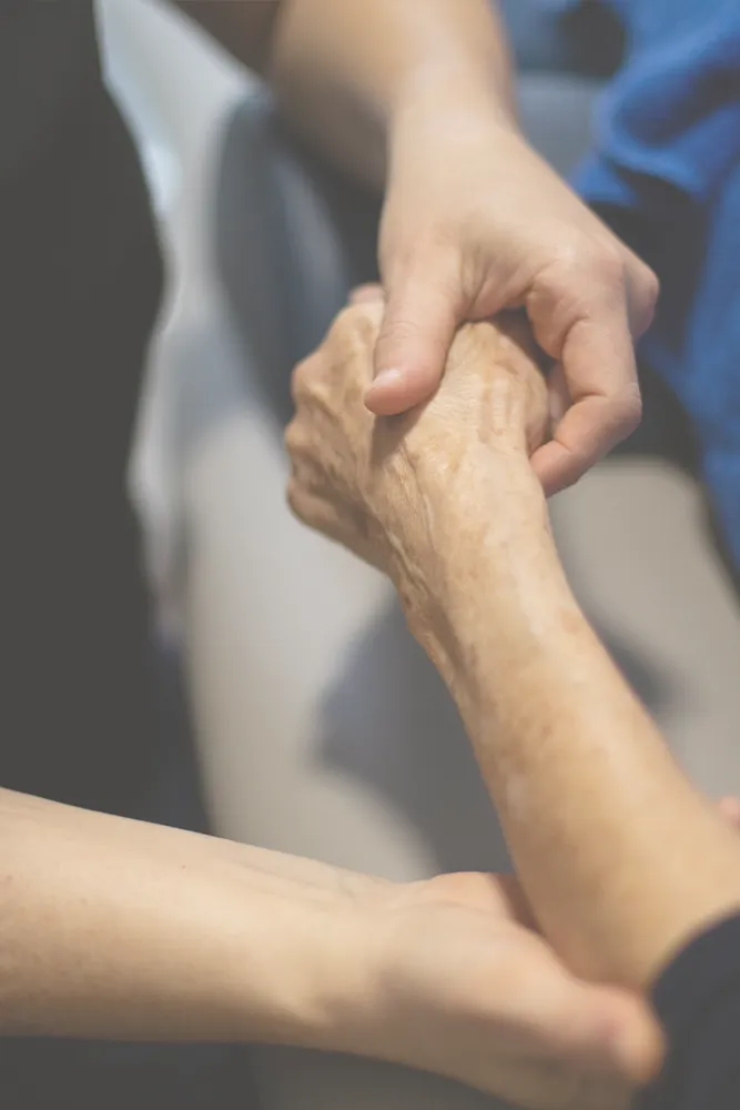 Dr Barbara Bugeja examining patient's arm